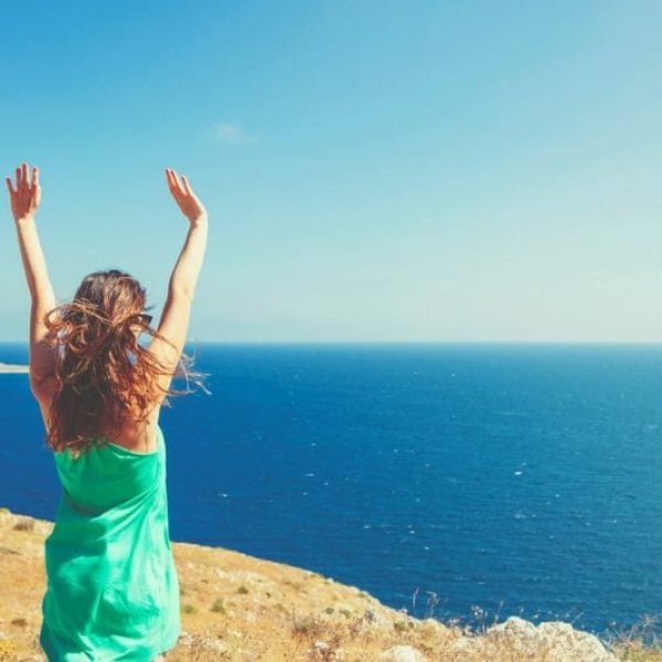 Happy lady looking at ocean